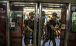 Protesters are seen trying to open a train door in Hong Kong on August 21, 2019, Thousands...