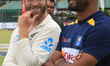 New Zealand cricket captain Kane Williamson (L) smiles at Sri Lankan cricket captain Dimut...