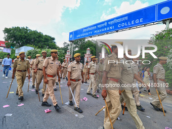 Police patrolling during the Rajasthan University Students Union (RUSU) election polling, outside Maharani College in Jaipur, Rajasthan, Ind...