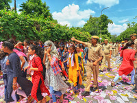 Police detain students and supporters of the candidates  during the Rajasthan University Students Union (RUSU) election polling, outside Mah...