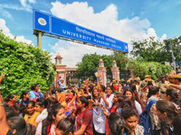 Police detain students and supporters of the candidates  during the Rajasthan University Students Union (RUSU) election polling, outside Mah...