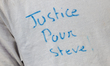 Participant asking 'Justice for Steve' in front of the Alexandre Vincent school where Stev...