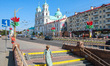 People walking in front of The Jesuit Cathedral of Hrodna are seen in Grodno, Belarus on 3...
