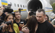Ukrainian film director Oleg Sentsov, who was jailed on terrorism charges in Russia, hugs...