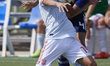 Iker Losada of Spain and Seiya Baba of Japan competes for the ball during the internationa...