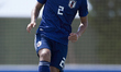 Ryuya Nishio of Japan controls the ball during the international friendly match between U1...