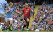 Kirsty Hanson (Manchester United) outpaces Keira Walsh (Manchester City) during English F...