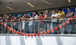 Pro-Beijing Protester are seen standing behind Chinese Flags inside a shopping mall in Hon...
