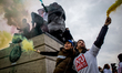 Protestors with smoke grenade at denfert rochereau square. A demonstration took place on M...