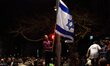 Tel-Aviv, Israel - March 15, 2015: An Israeli girl waves an ISraeli flag while participati...