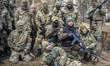 Group of volunteers and reserve soldiers listening a class at training center 'Patriot', K...