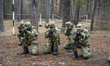 Volunteers and reserve soldiers are learning basics of military stances and moves at train...