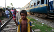 Peoples are living in the makeshift home in the slums of a next to railway tracks at kawra...