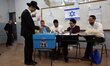 BNEI-BRAK, ISRAEL - MARCH 17, 2015: An Ultra-Orthodox jewish man posts his vote in a polli...