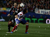 Atletico de Madrid's Croatian forward Mario Mandzukic and Bayer Leverkusen´s Brazilian Defender WENDELL during the Champions League 2014/15...