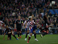 Atletico de Madrid's French forward Antoine Griezmann and Bayer Leverkusen´s Brazilian Defender WENDELL  during the Champions League 2014/15...
