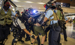 Police are seen arresting a protester inside a shopping mall in Sha Tin in Hong Kong on Se...