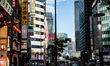 People are seen walking in the city center of Tokyo near Tokyo tower. Daily life in Tokyo,...