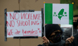 A demonstrator is seen holding a World Taiwanese Congress flag during a rally against Chin...