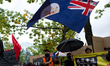 A demonstrator is seen waving a British Hong Kong flag during a rally against Chinese Gove...