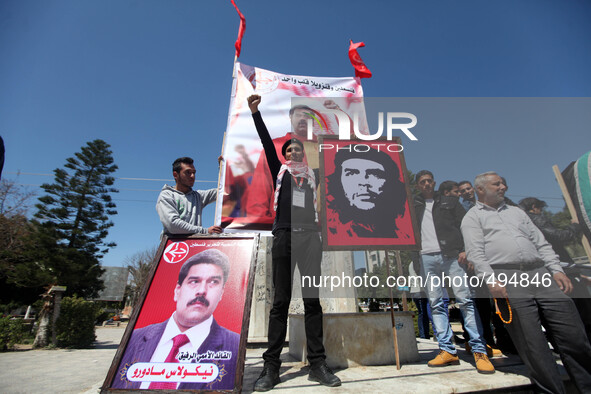 Palestinian supporters of the Popular Front for the Liberation of Palestine (PFLP) take part in a protest to show solidarity with the Venezu...