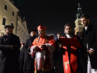 People carry the Cross near Krakow's  Market Hall (Polish: Sukiennice) during the Way of the Cross 'There is a worst SMOG' presided by Cardi...