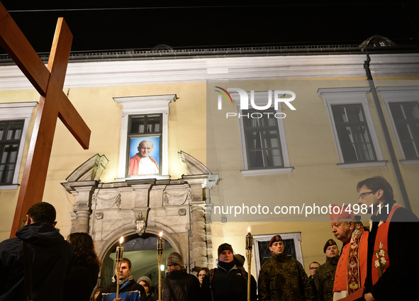 People carry the Cross in front of the 'Papal Window' during the Way of the Cross 'There is a worst SMOG' presided by Cardinal Stanislaw Dzi...