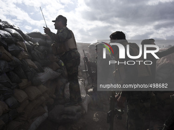 Members of the Kurdish Peshmerga forces, PKK and YPG fighting for retaking the Sinjar City from ISIS, on March 23, 2015. (