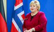 Prime Minister of Norway Erna Solberg reacts while speaking to the media with German Chanc...