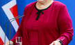 Prime Minister of Norway Erna Solberg reacts while speaking to the media with German Chanc...