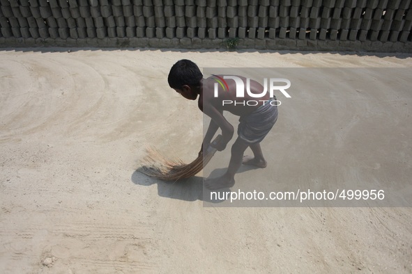 A child laborer is working only for BDT. 150 ($1.8) in a brick field of Rajendrapur near Dhaka, Bangladesh, 24 March, 2015. 