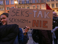 Protester holding sign that says 'Sex - Yes, Sexism - No' during the rally against a bill that would criminalize sex education is seen in Gd...
