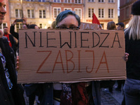 Protester holding sign that says 'Ignorance kills' during the rally against a bill that would criminalize sex education is seen in Gdansk, P...