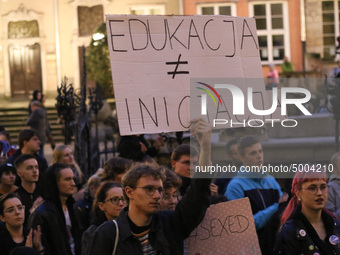Protester holding sign that says 'Educations is not a (sexual) initiation' during the rally against a bill that would criminalize sex educat...