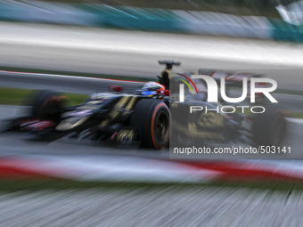French Romain Grosjean of Lotus F1 Team in action during second practice session of Malaysian Formula One Grand Prix at Sepang Interational...