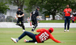 Tim Seifert (L) and Colin Munro of New Zealand XI run between the wickets during the first...