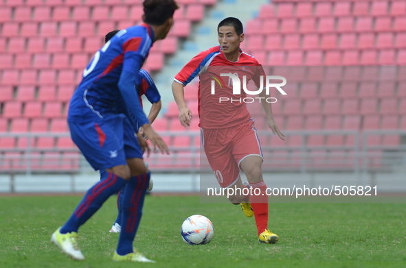 Kim Ju Song of DPR Korea (R) in actions during the AFC U-23 Championship 2016 qualifiers round at Rajamangala Stadium in Bangkok, Thailand o...