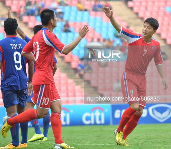 Jo Kwang of DPR Korea (R) celebrates with teammate after scoring during the AFC U-23 Championship 2016 qualifiers round at Rajamangala Stadi...