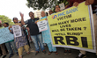 Account holders of the Punjab and Maharashtra Co-operative Bank (PMC Bank) hold placards d...