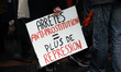 A placard reads 'More anti-prostitution decree equal more repression'.  Several NGOs as th...