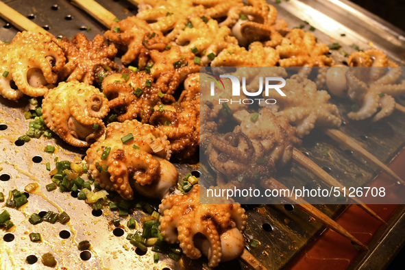 BBQ grilled baby octopus seen for sale on Zhongshan Snack Street, the biggest night food market in Nanning, the capital city of Guangxi, wit...