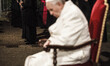 A priest carries the cross as Pope Francis leads the Way of the Cross (Via Crucis) torchli...