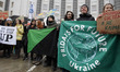 Climate demonstrators hold placards and banners during the 'Global climate strike', as par...