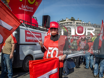 A FO member demonstrator holding a FO flag during a protest as part of a national mobilization against the government's austerity measures a...