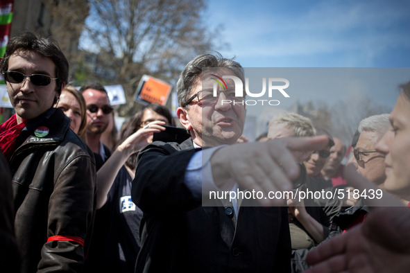 Jean Luc melanchon shaking hands  during a protest as part of a national mobilization against the government's austerity measures and for al...
