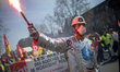 Steel industry workers with gaz smoke during a protest as part of a national mobilization...