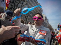 A demonstrator giving glass that reads i dont like macron during a protest as part of a national mobilization against the government's auste...