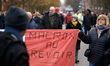 A woman holds a French flag reading 'Macron godbye'. Between 60 and 80000 protesters took...