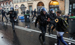 A Gendarme Mobile (military) scuffles with a protester. Between 60 and 80000 protesters to...