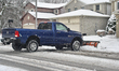 Snow plow clears a driveway as a massive snowstorm hit Toronto, Ontario, Canada, on Decemb...